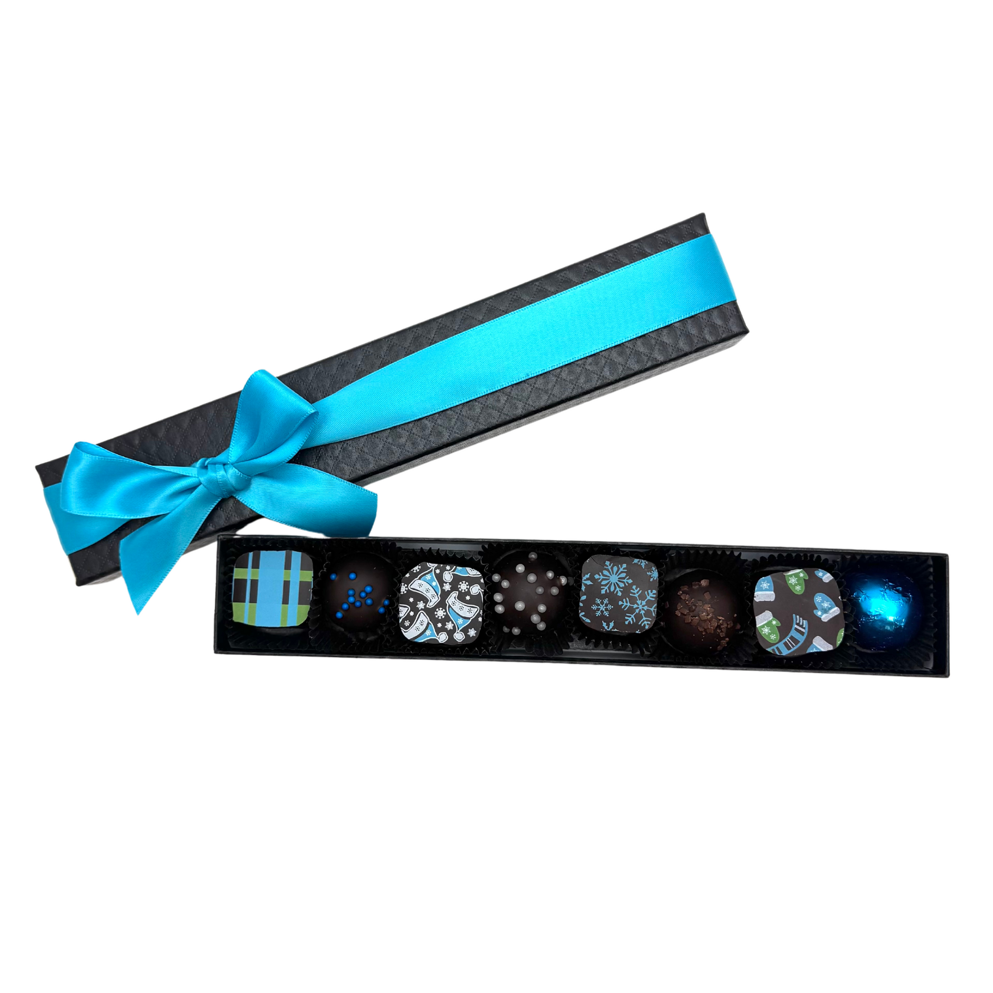 8-piece Winter Collection chocolate box from Chocolat Celeste, featuring festive bonbons in a long black quilted box with turquoise satin ribbon – part of Christmas in July Pre-Sale
