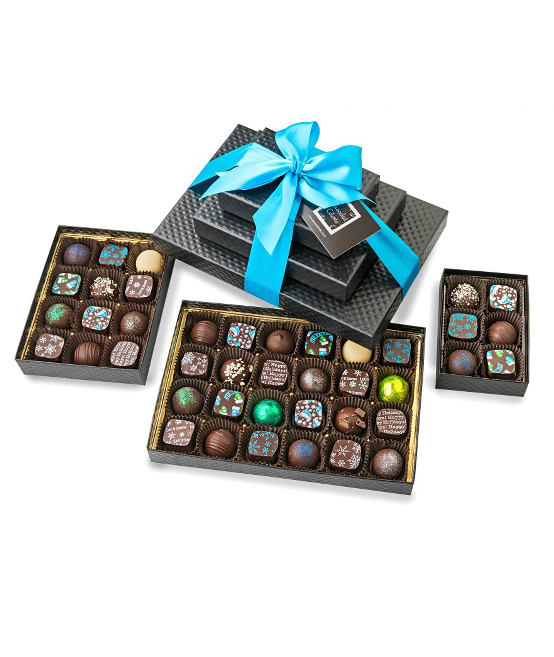 42-piece Triple Winter Treat gift tower from Chocolat Celeste, featuring three stacked black quilted boxes filled with festive holiday bonbons tied with a turquoise satin ribbon – part of Christmas in July Pre-Sale